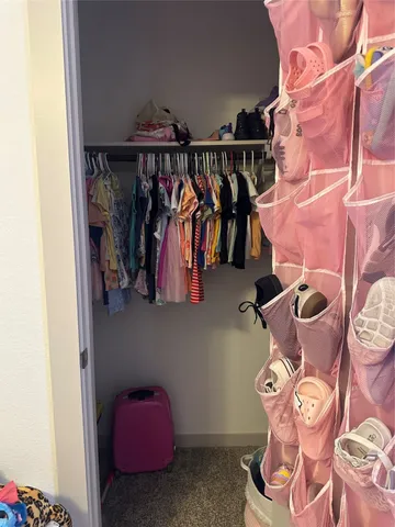 a bedroom with a bed and a cabinets