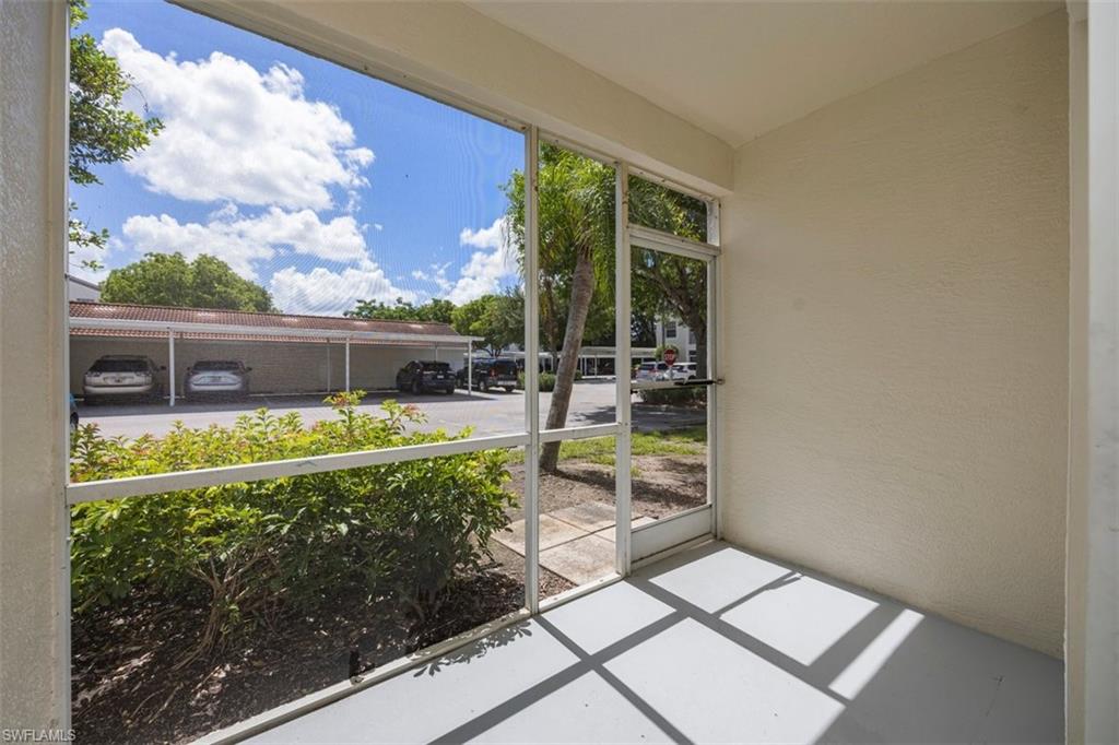 4635 St Croix Lane, Unit 1218 Naples, FL 34109 - Photo 21 of 40 View of unfurnished sunroom