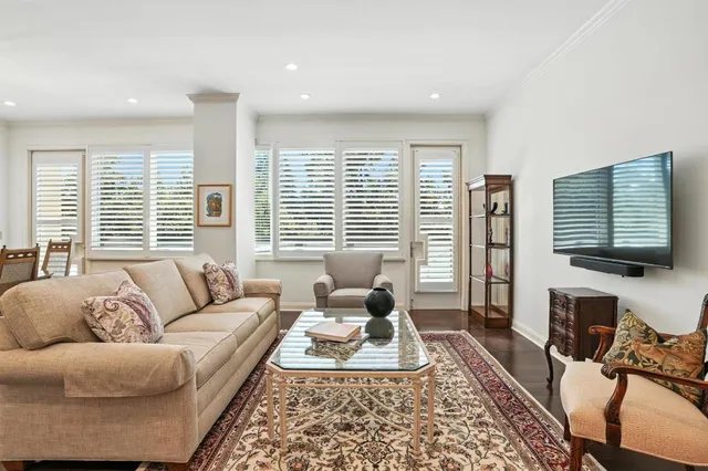 a living room with furniture or couch and a large window