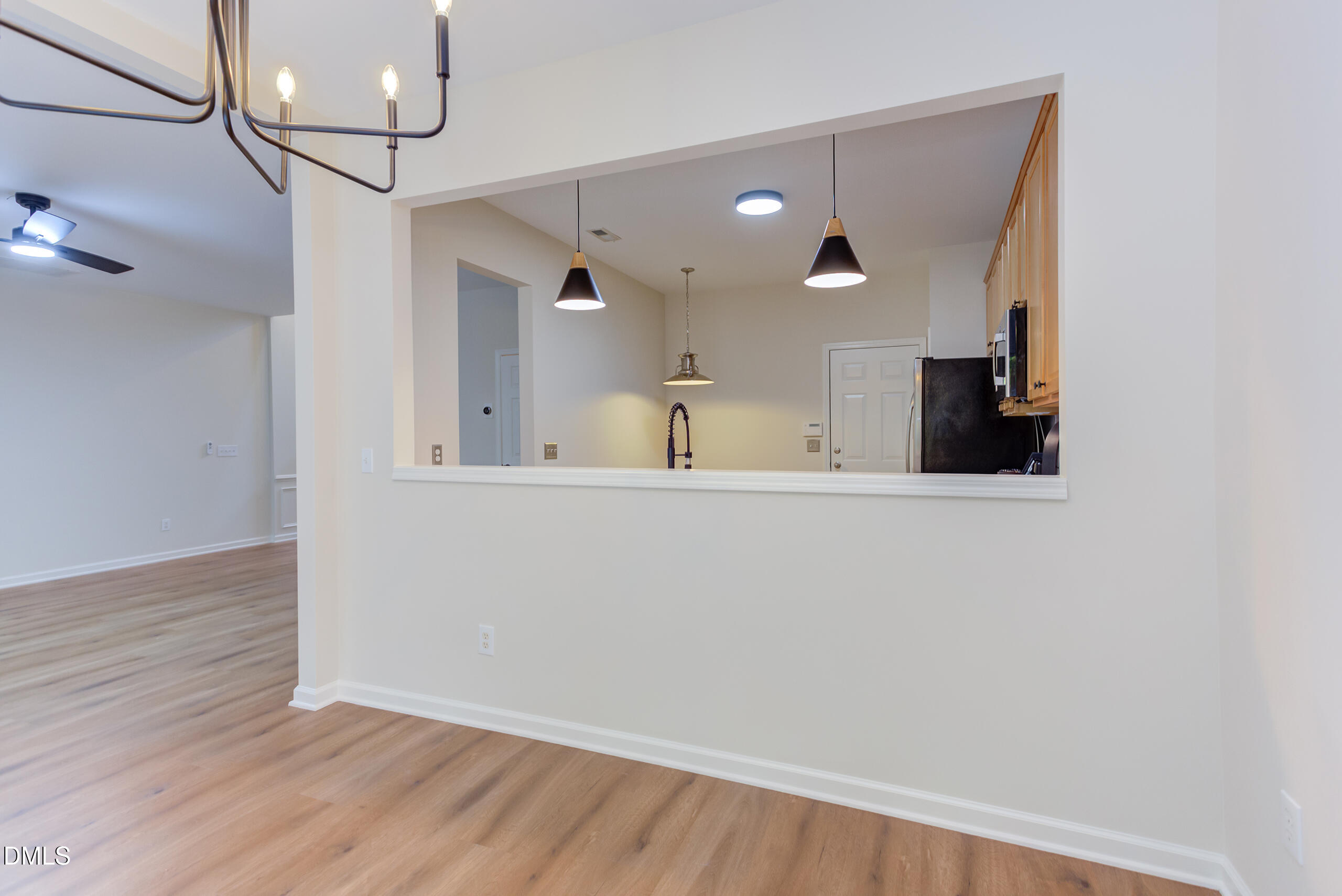 5620 Berry Creek Circle Raleigh, NC 27613 - Photo 10 of 38 Kitchen pass thru with new pendant lighting.