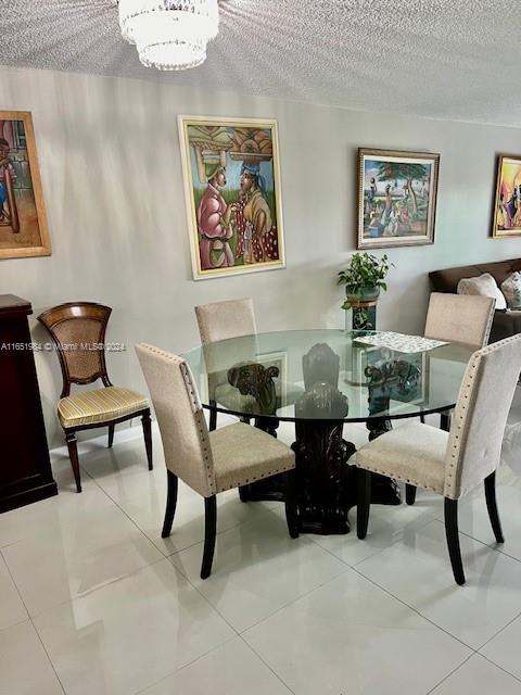 6100 Northwest 44th Street, Unit 405 Lauderhill, FL 33319 - Photo 21 of 46 a dining room with furniture and paintings on the wall