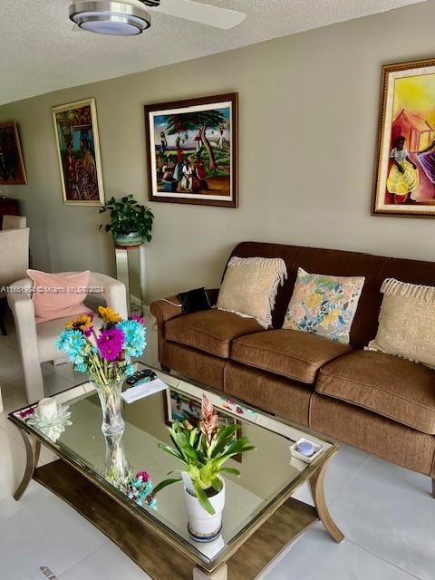 6100 Northwest 44th Street, Unit 405 Lauderhill, FL 33319 - Photo 25 of 46 a living room with furniture flowerpot and a chandelier