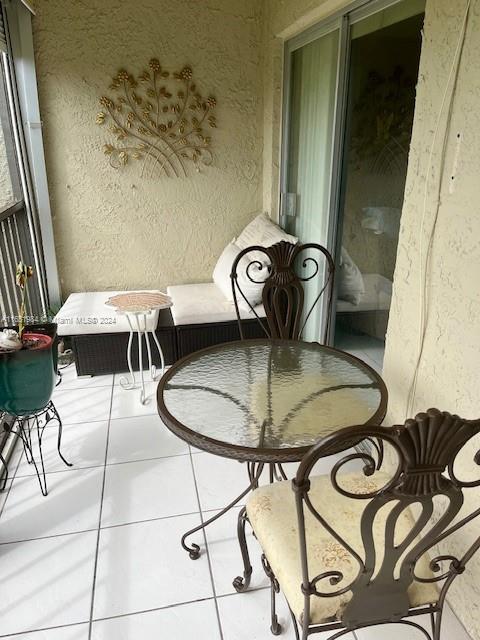 6100 Northwest 44th Street, Unit 405 Lauderhill, FL 33319 - Photo 39 of 46 a view of a dining room with furniture