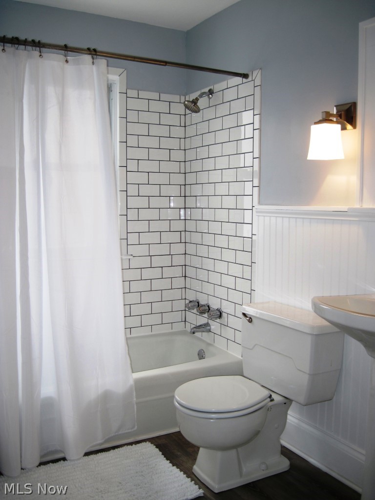 1590 Rydalmount Road Cleveland Heights, OH 44118 - Photo 14 of 16 2019 RENOVATED SECOND FLOOR BATHROOM WITH TILES, BEAD BOARD, NEW LIGHT FIXTURE, AND WOOD GRAIN FLOORING!