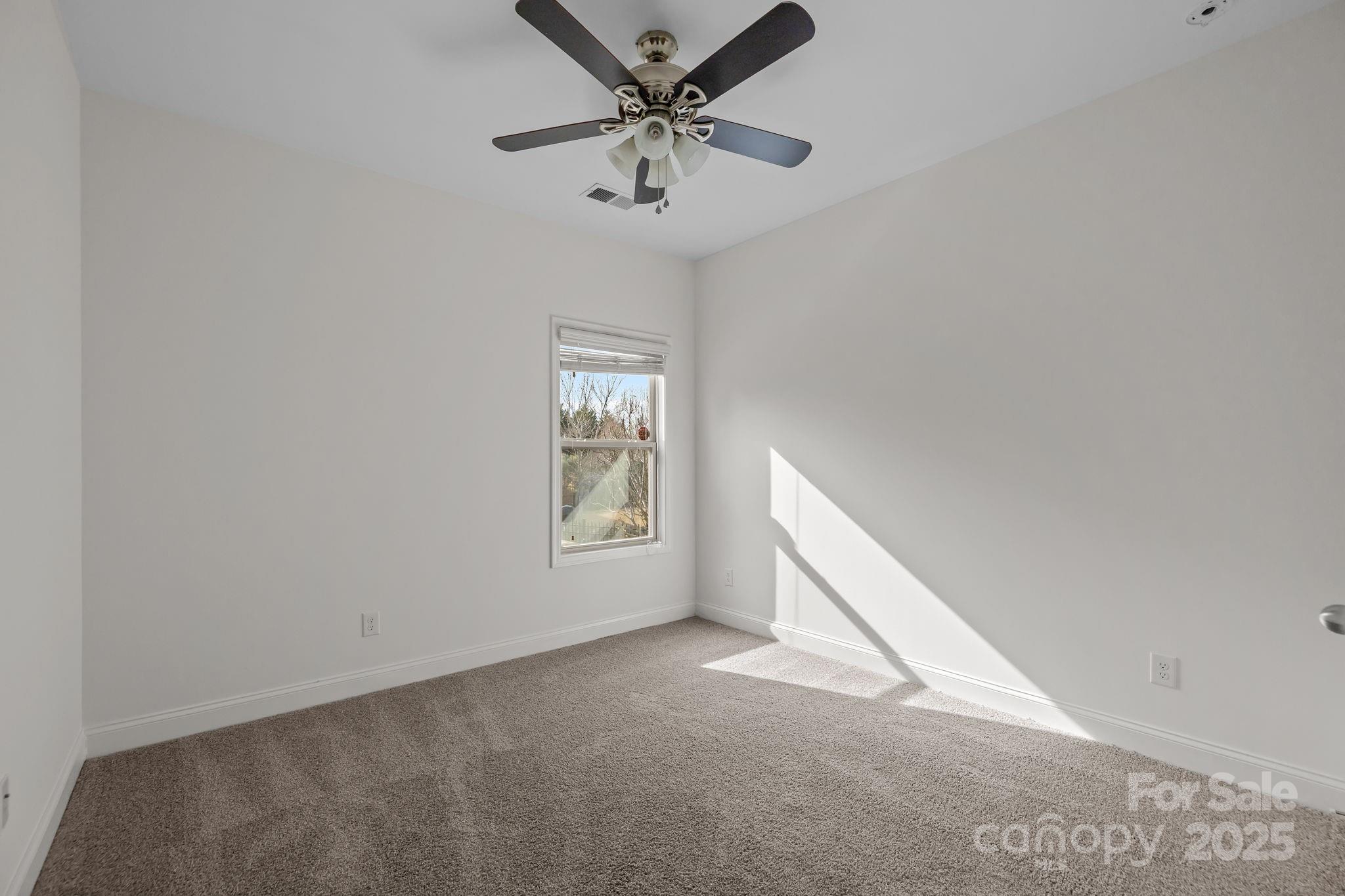 7020 Sedgewick Road Indian Trail, NC 28079 - Photo 17 of 42 a view of an empty room with a window