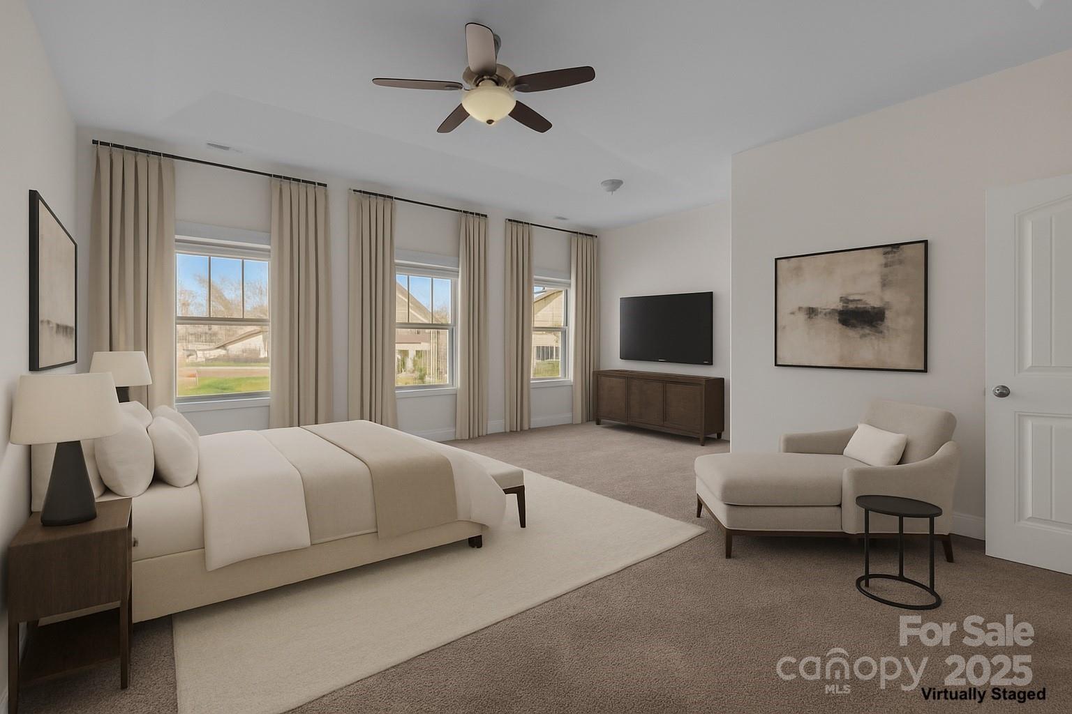 7020 Sedgewick Road Indian Trail, NC 28079 - Photo 20 of 42 a spacious bedroom with a bed and a flat screen tv