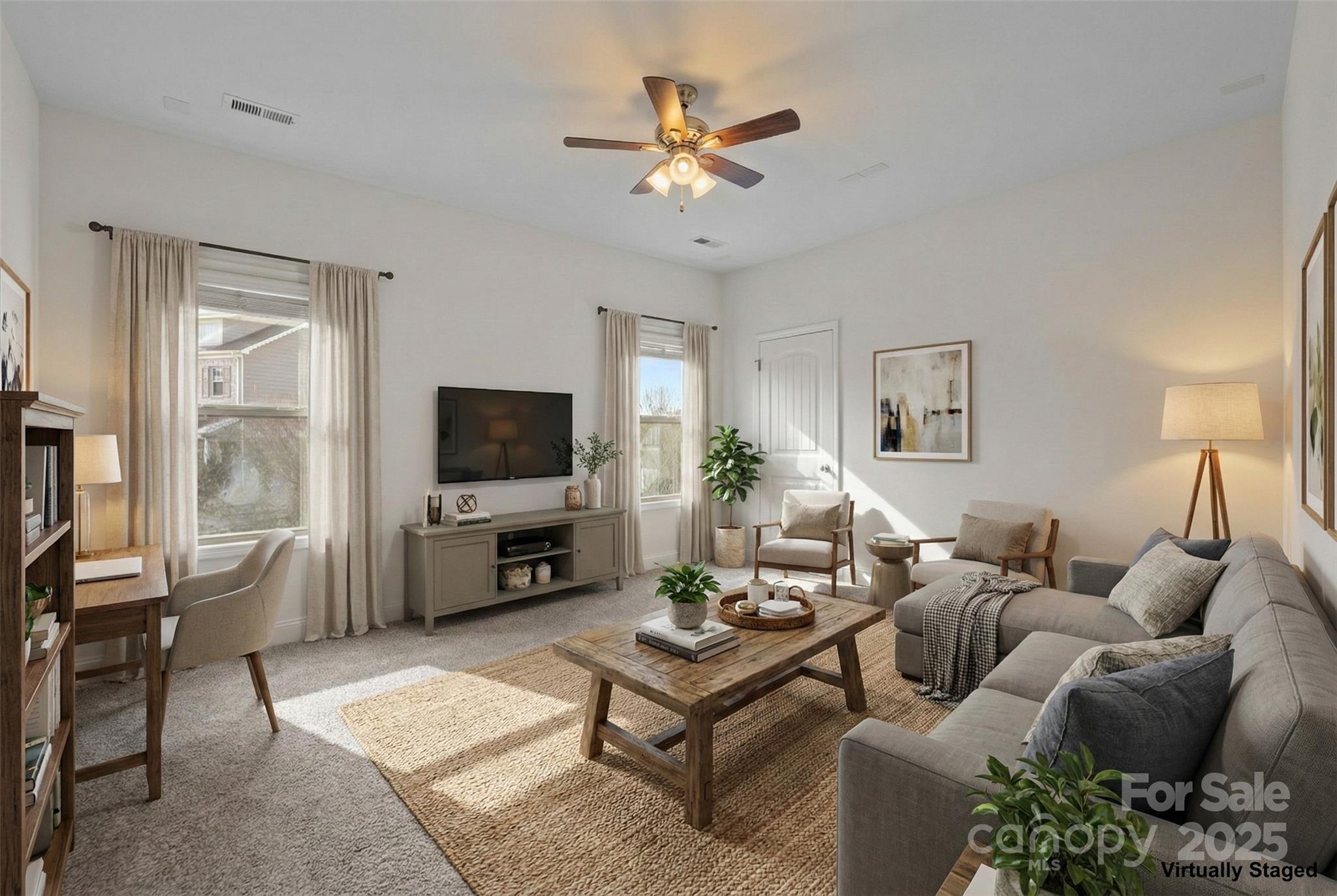 7020 Sedgewick Road Indian Trail, NC 28079 - Photo 30 of 42 a living room with furniture and a flat screen tv