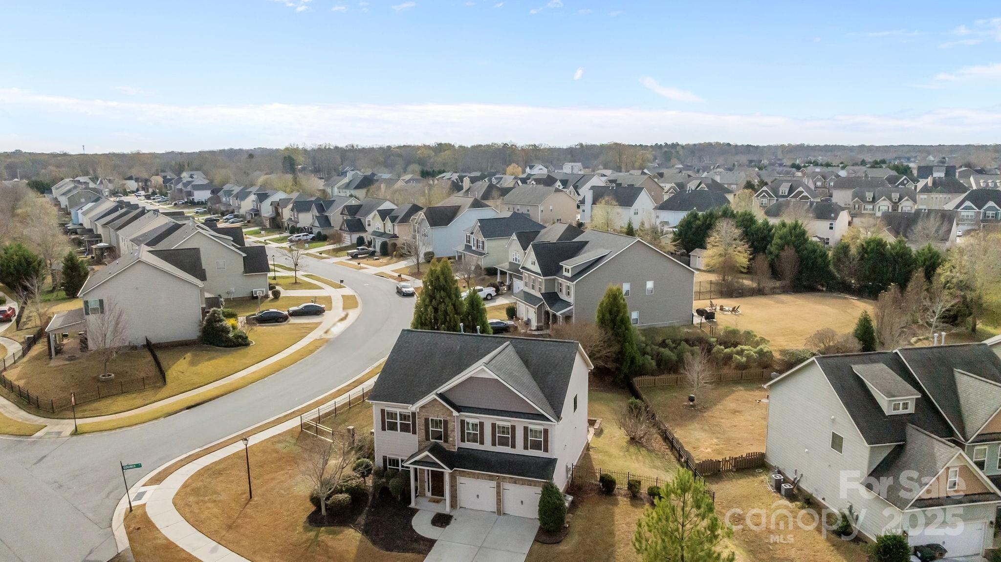 7020 Sedgewick Road Indian Trail, NC 28079 - Photo 38 of 42 a view of a house with a swimming pool