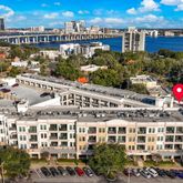 a large building with a lot of trees in front of it