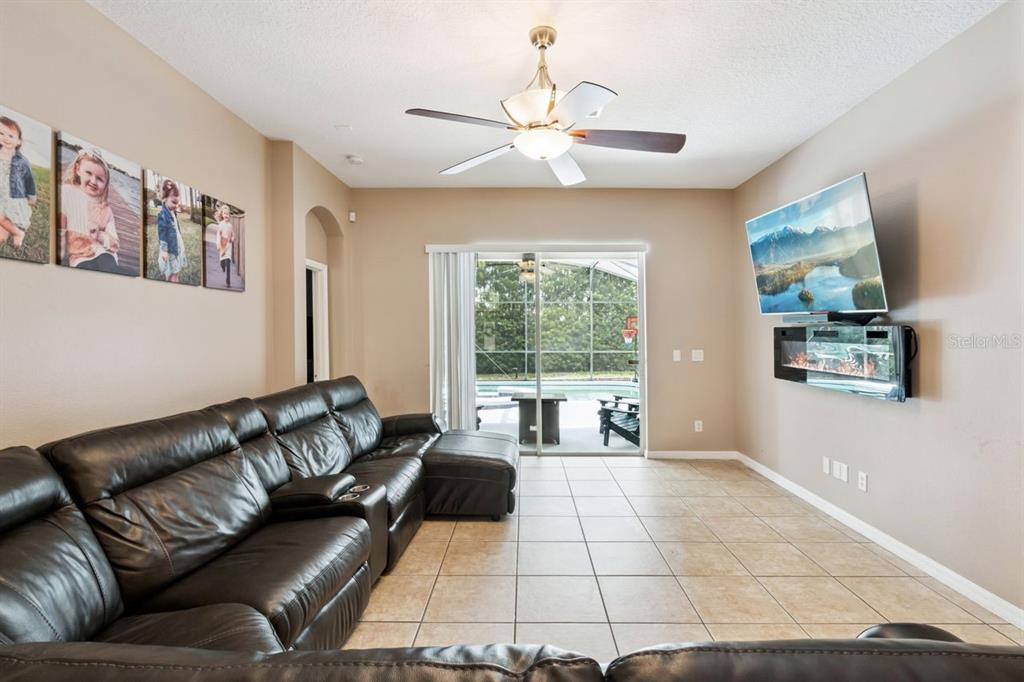 8484 Dover View Lane Orlando, FL 32829 - Photo 10 of 41 a living room with furniture and a large window