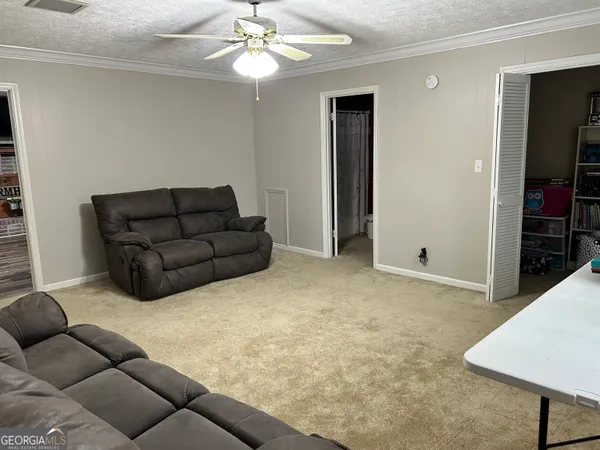 a bathroom with a shower curtain and a window