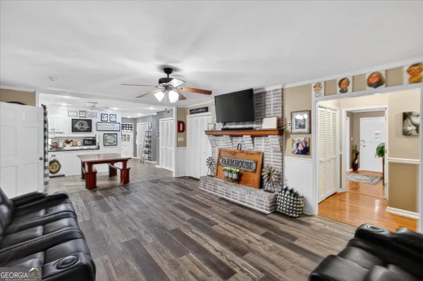 a living room with furniture and a flat screen tv