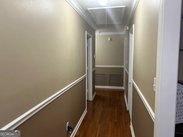 a kitchen with stainless steel appliances and white cabinets