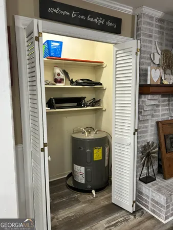 a bedroom with furniture and wooden floor