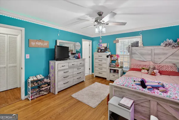 a bedroom with a bed and furniture