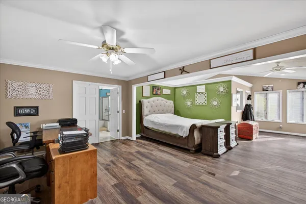 a bed room with a bed and a chandelier