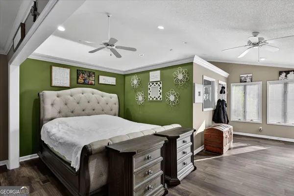 a view of walk in closet with clothes