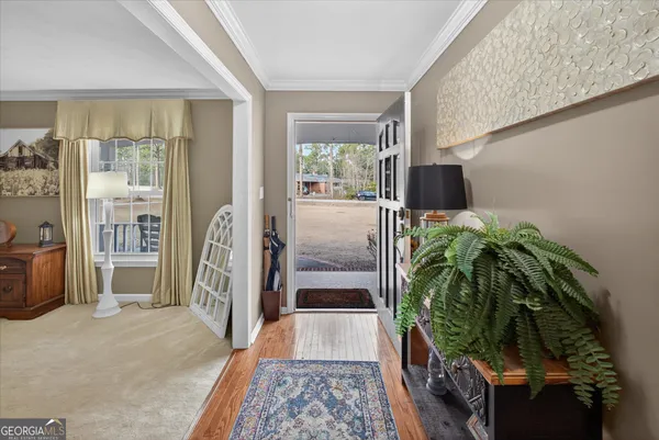 a room with view of walk in closet and bedroom