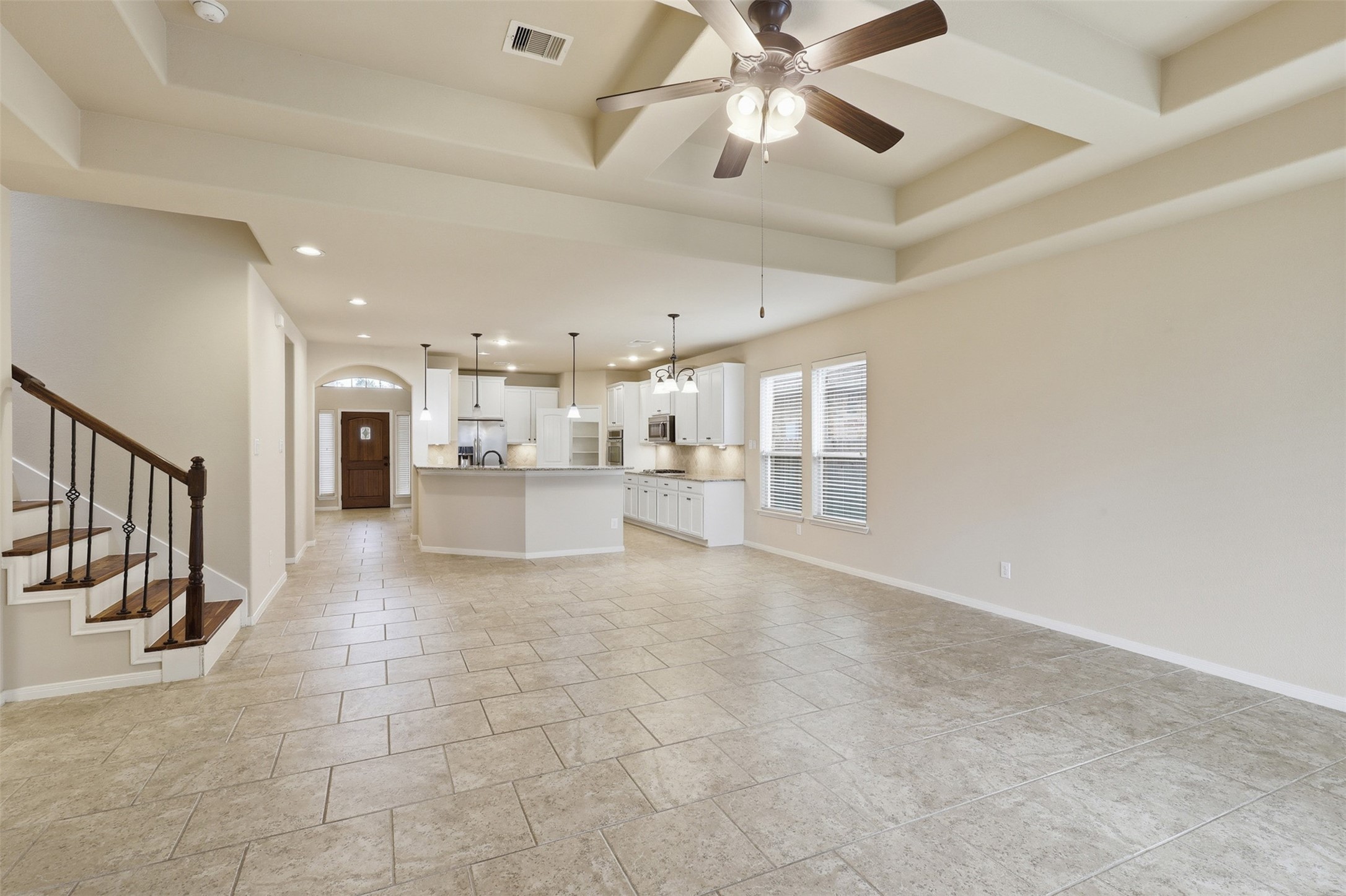 22943 Dale River Road Tomball, TX 77375 - Photo 12 of 29 a view of a hallway with a chandelier