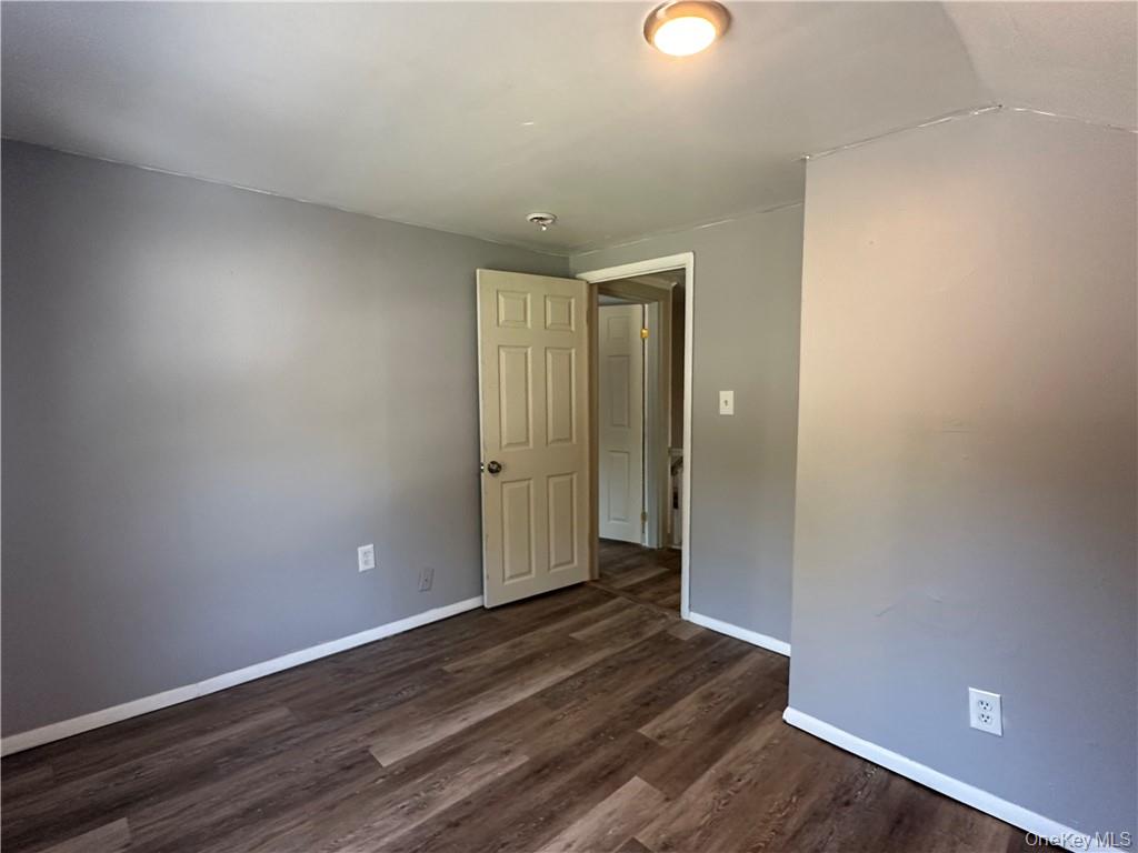 1399 State Rte 55, Unit 11 Clintondale, NY 12515 - Photo 15 of 21 Spare room with dark wood-type flooring