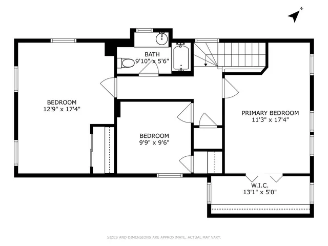 a view of a backyard with wooden fence