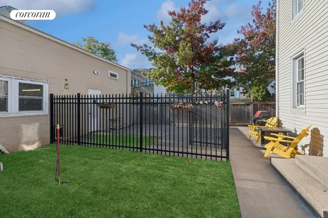 a kitchen with stainless steel appliances granite countertop a stove a sink dishwasher and a refrigerator with wooden cabinets