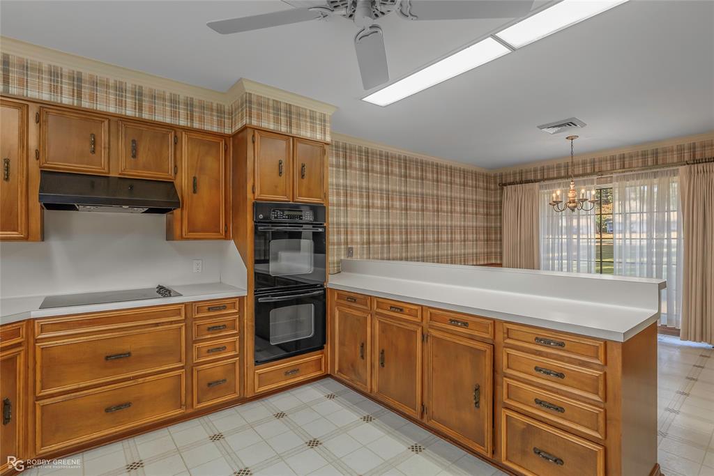 3073 Risinger Drive Shreveport, LA 71119 - Photo 13 of 39 a kitchen with stainless steel appliances granite countertop a sink and cabinets