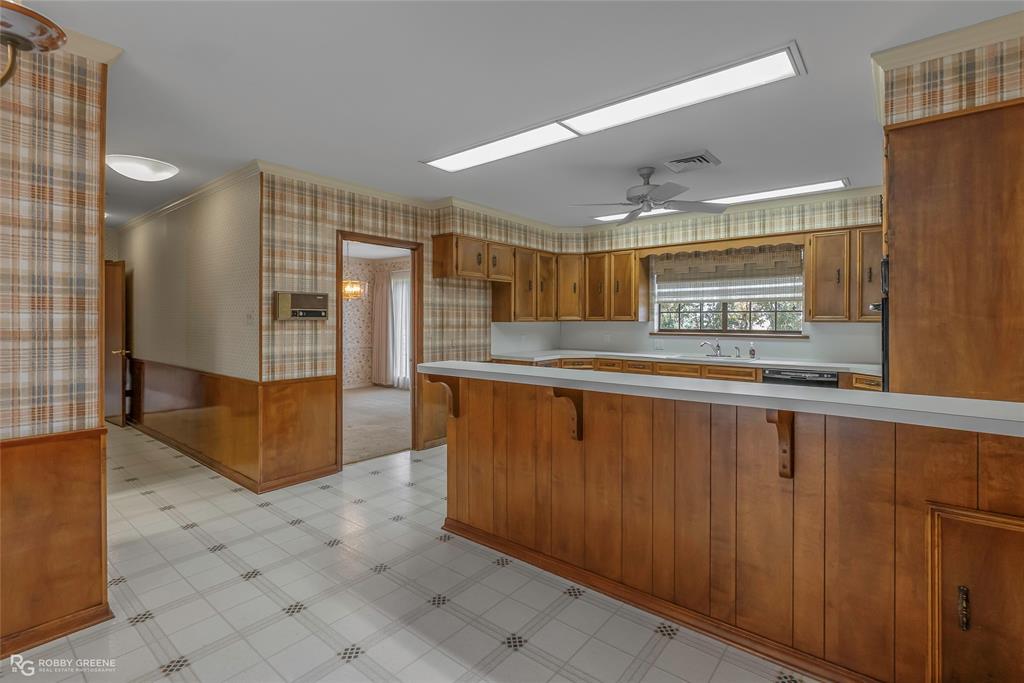 3073 Risinger Drive Shreveport, LA 71119 - Photo 16 of 39 a kitchen with stainless steel appliances granite countertop a refrigerator and a stove