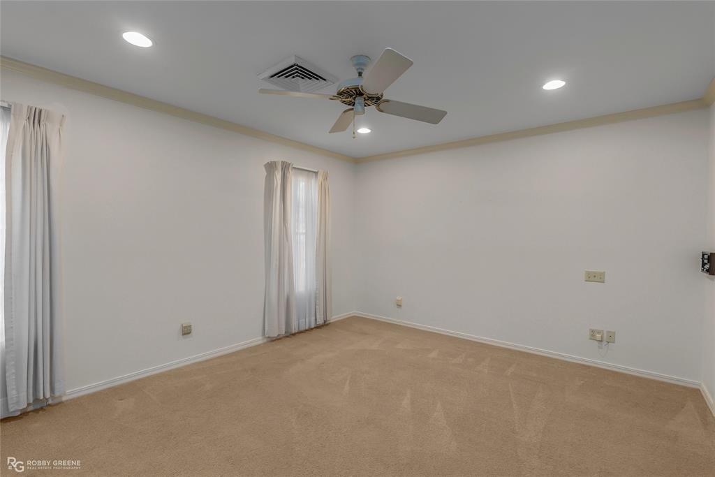 3073 Risinger Drive Shreveport, LA 71119 - Photo 18 of 39 an empty room with a ceiling fan and a window