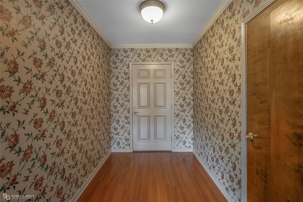 3073 Risinger Drive Shreveport, LA 71119 - Photo 5 of 39 a view of a hallway with wooden floor and a bathroom