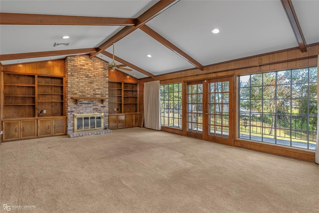3073 Risinger Drive Shreveport, LA 71119 - Photo 6 of 39 a view of an empty room with a sliding door and wooden floor