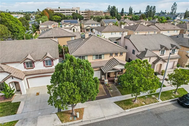 an aerial view of a house with a yard