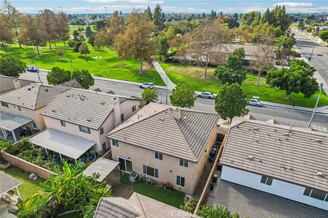an aerial view of residential building with parking