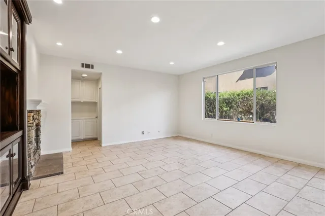 a large kitchen with stainless steel appliances kitchen island a large counter top and oven