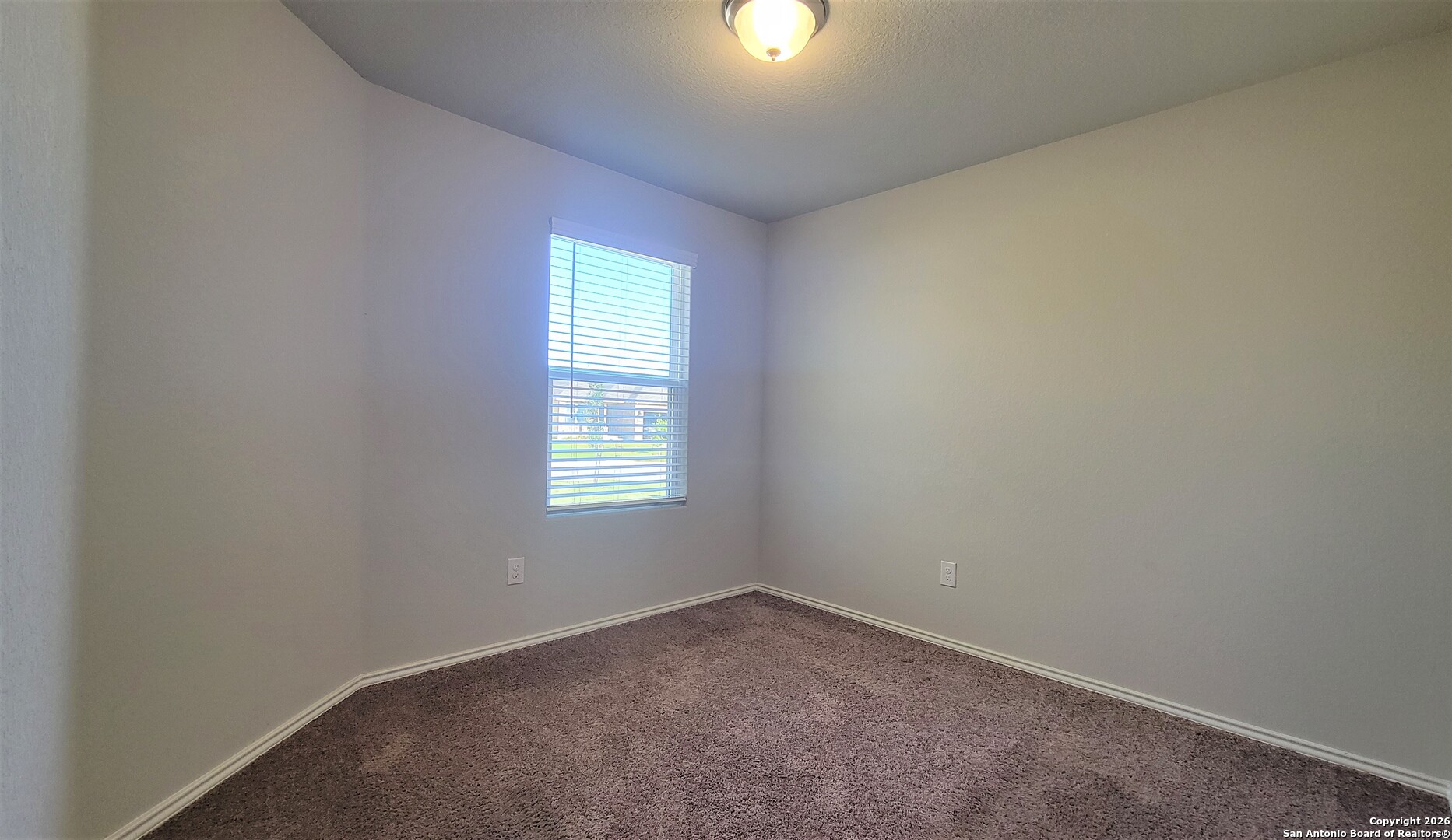 7136 Quarter Moon Converse, TX 78109 - Photo 12 of 22 an empty room with a window