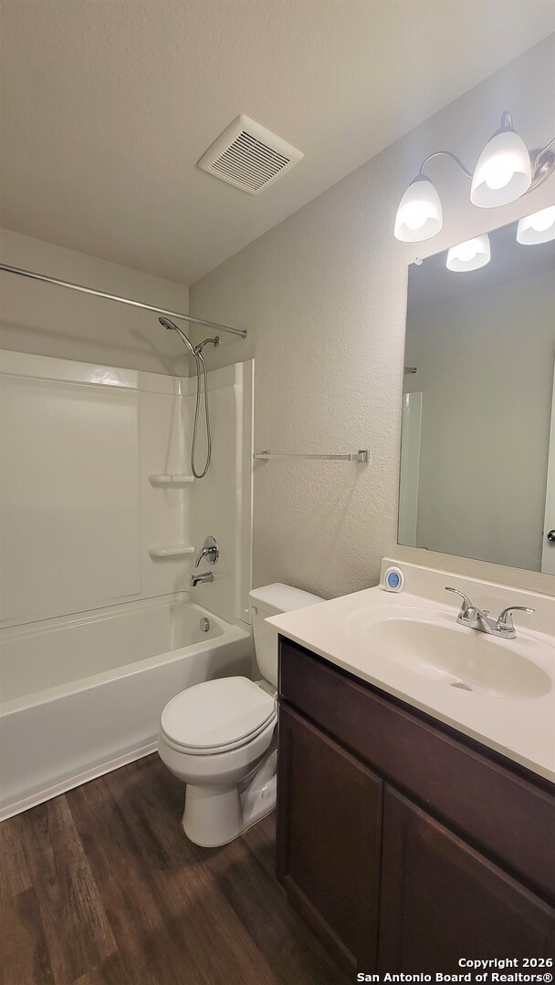 7136 Quarter Moon Converse, TX 78109 - Photo 14 of 22 a bathroom with a sink a toilet a mirror and shower