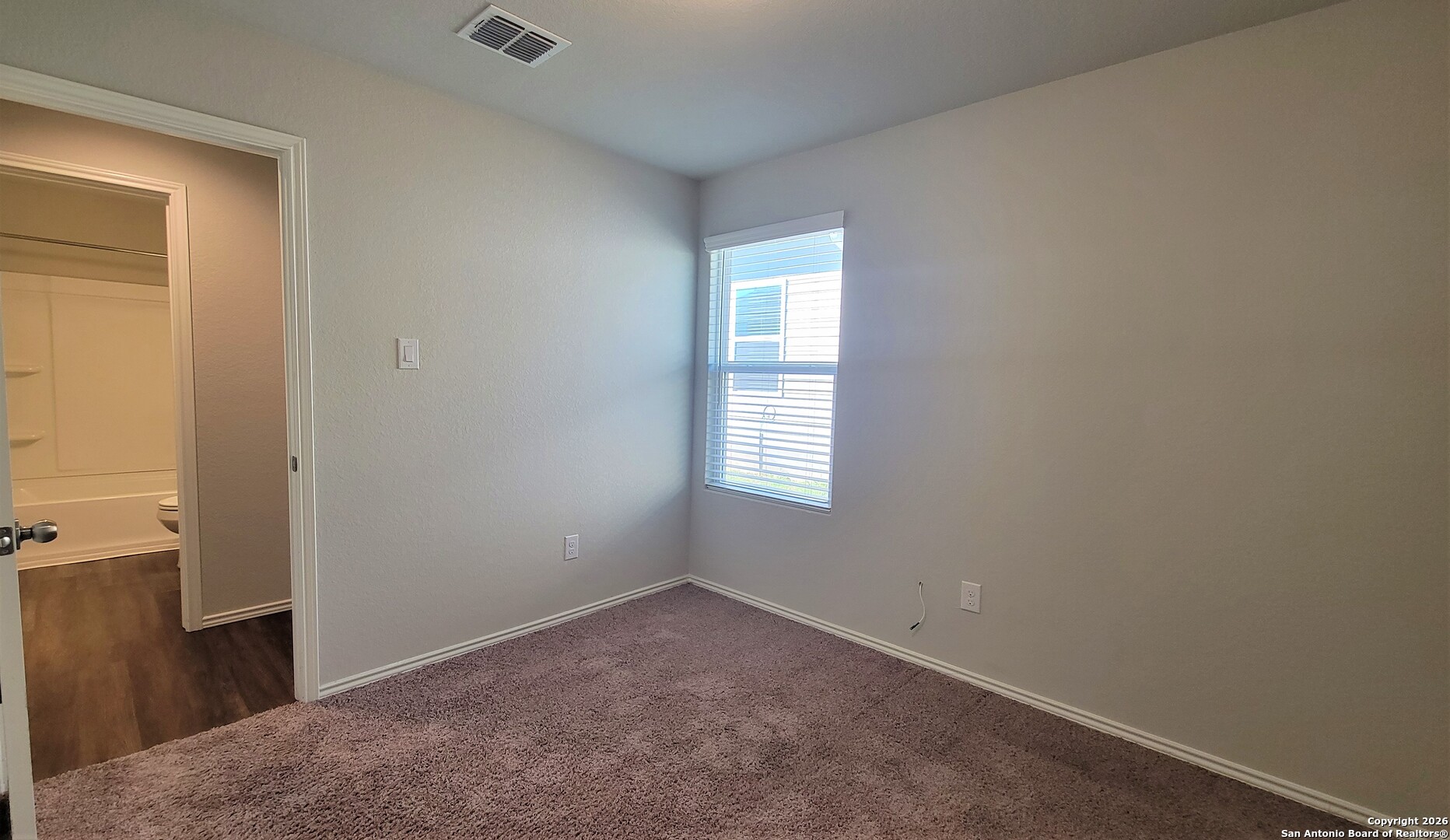 7136 Quarter Moon Converse, TX 78109 - Photo 15 of 22 an empty room with windows