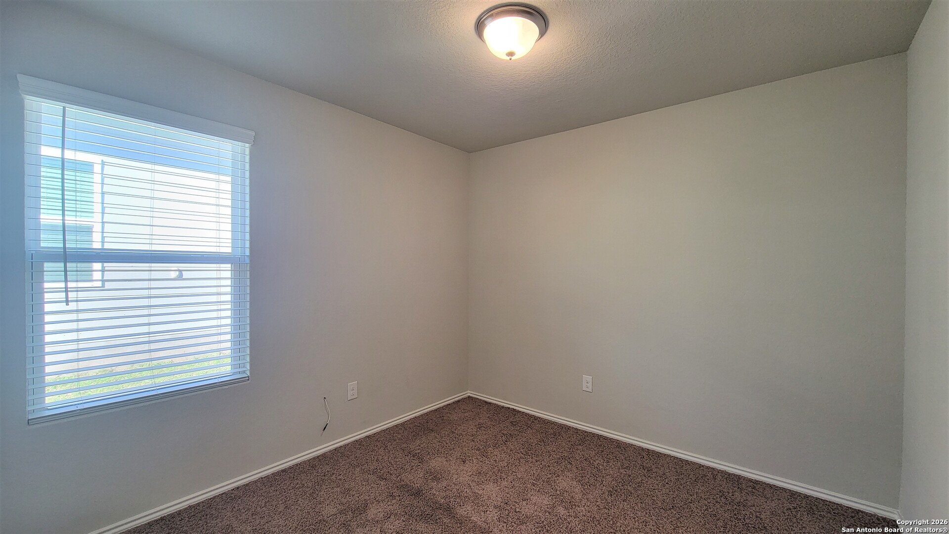 7136 Quarter Moon Converse, TX 78109 - Photo 16 of 22 an empty room with a window