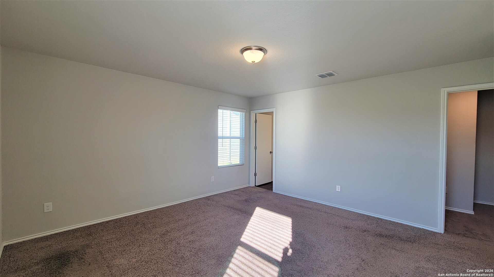 7136 Quarter Moon Converse, TX 78109 - Photo 9 of 22 an empty room with windows
