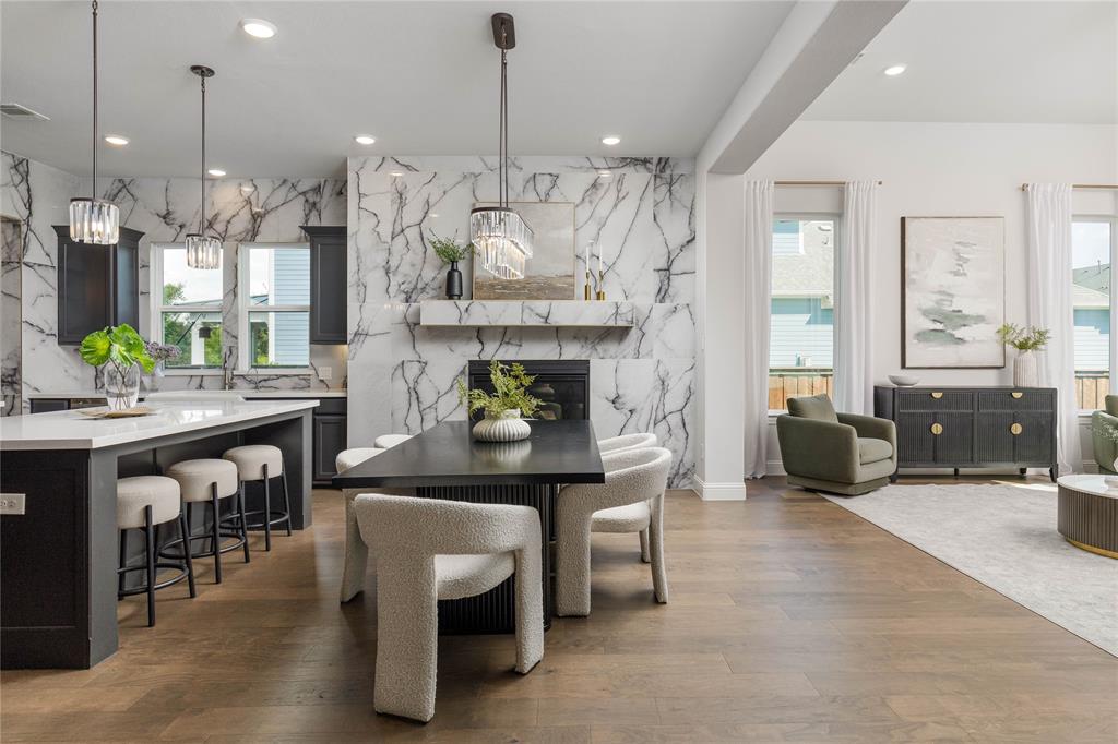 7409 Cormac Street McKinney, TX 75071 - Photo 12 of 40 Breakfast room has a fireplace to warm the entire space.