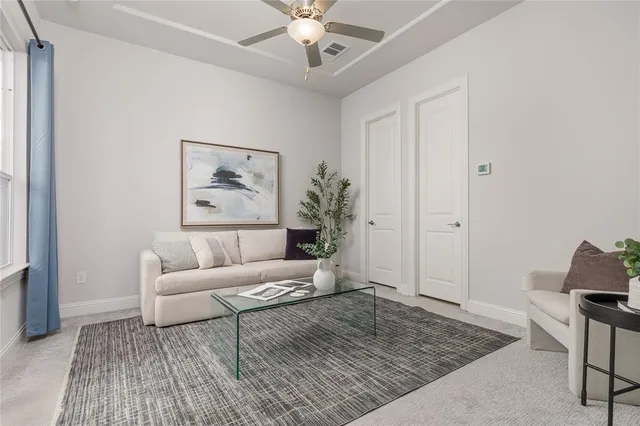 a living room with furniture and a rug