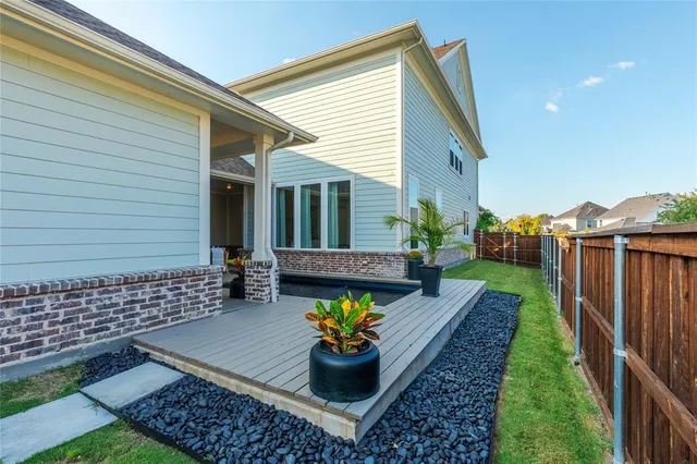 a view of a chairs and table in the patio