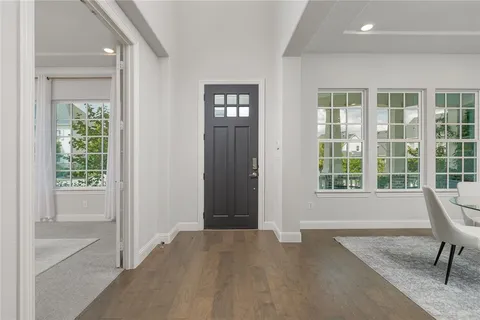 a view of livingroom with furniture window and front door