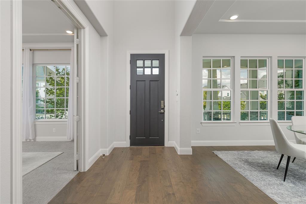 7409 Cormac Street McKinney, TX 75071 - Photo 5 of 40 Front entry flanked by a private office and formal dining area.