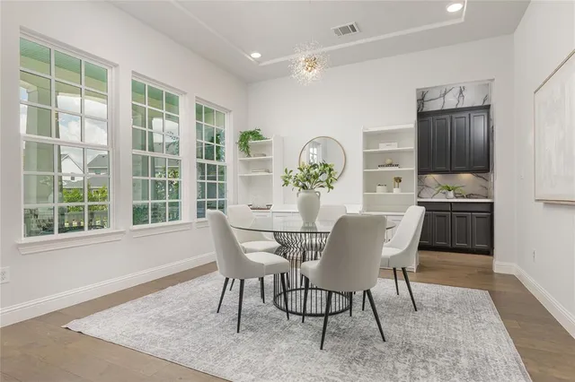 a dining room with furniture and window