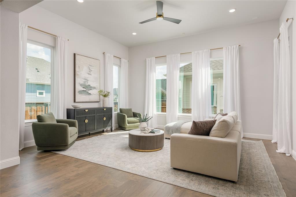 7409 Cormac Street McKinney, TX 75071 - Photo 8 of 40 Living room is filled with natural light.