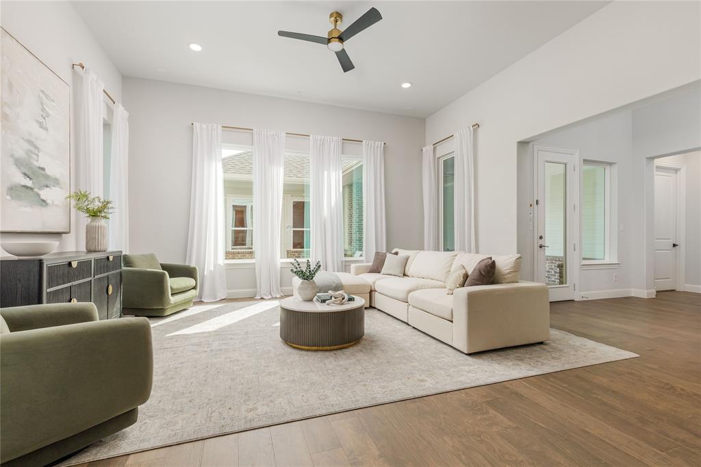 7409 Cormac Street McKinney, TX 75071 - Photo 9 of 40 Living room is filled with natural light.