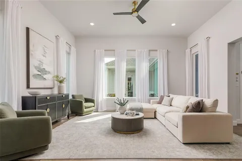 a living room with furniture and windows