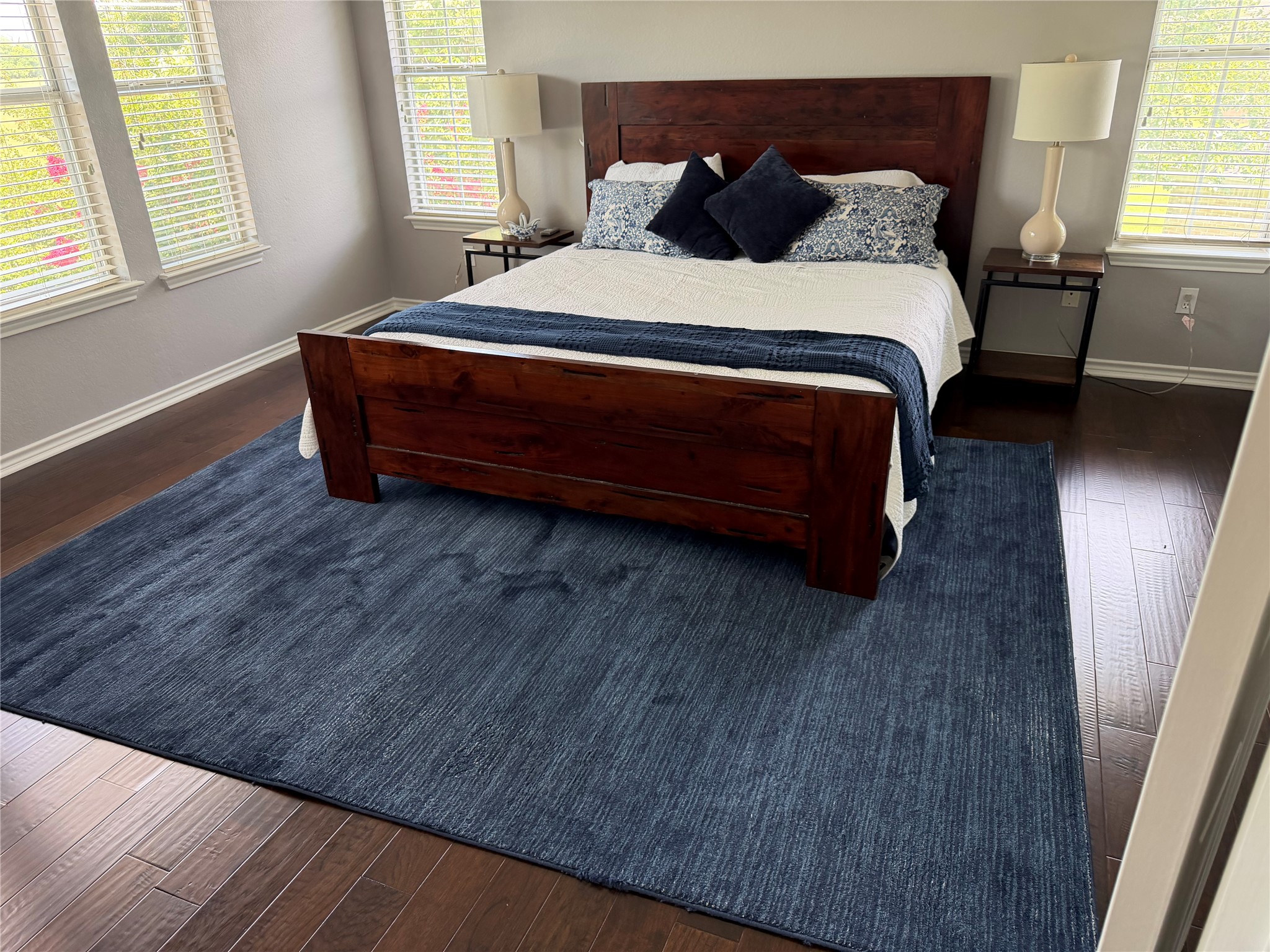 13 Oak View Round Rock, TX 78664 - Photo 15 of 30 Well-lit sleeping quarters with rich hardwood flooring and ample natural light.