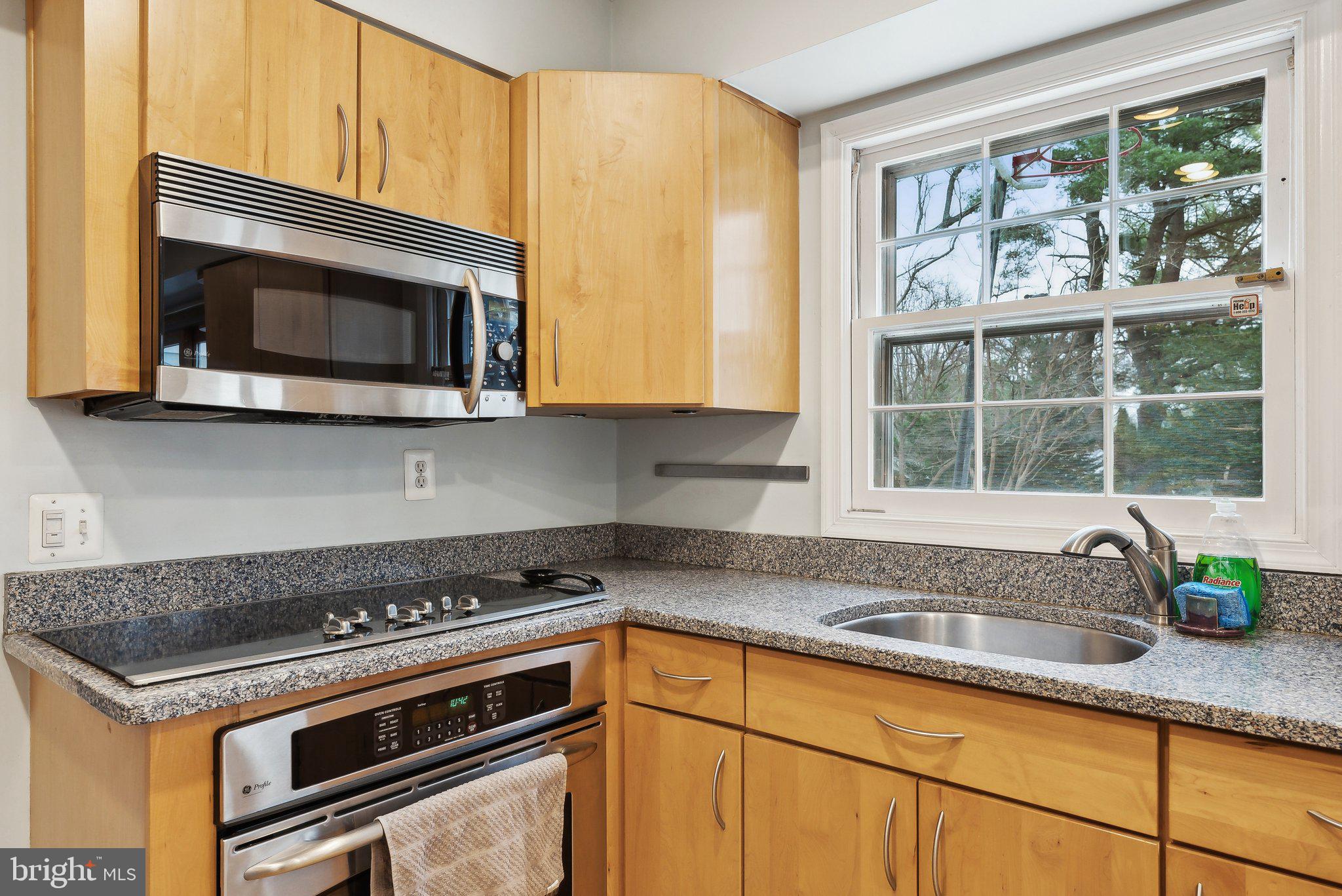 2940 Beaverwood Lane Silver Spring, MD 20906 - Photo 6 of 26 Stainless steel appliances and view of the yard